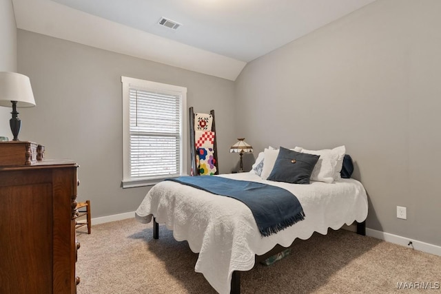 carpeted bedroom featuring vaulted ceiling