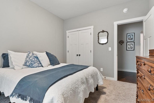 carpeted bedroom featuring a closet