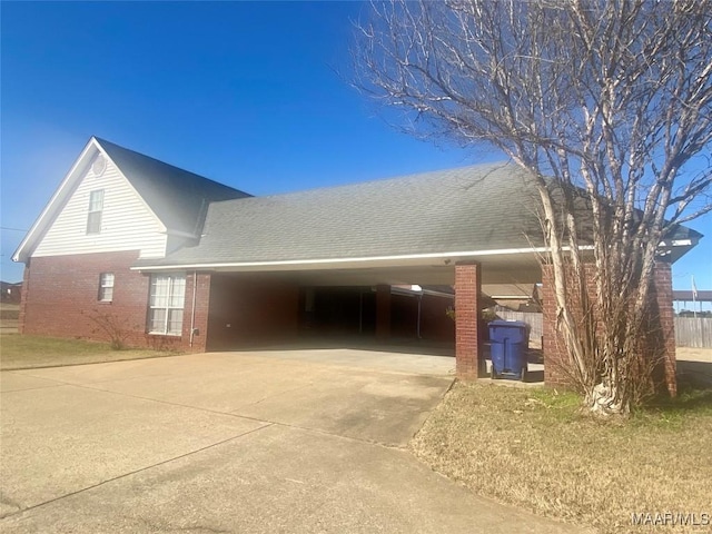 exterior space with a carport