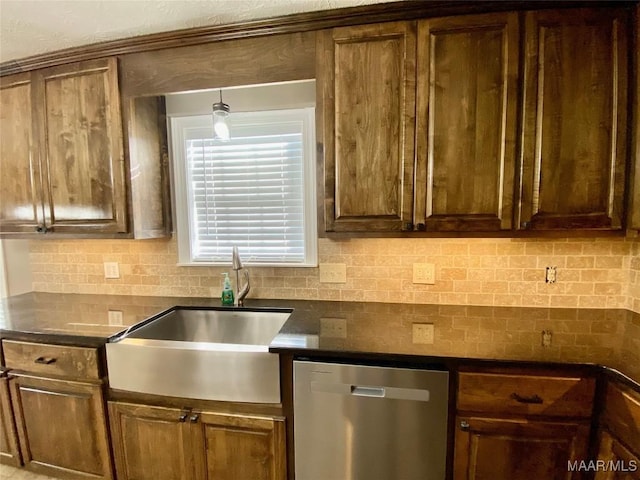 kitchen with backsplash, dishwasher, and sink