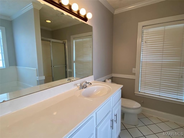 bathroom featuring tile patterned floors, crown molding, vanity, and walk in shower