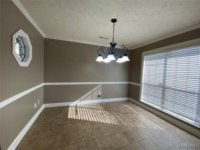 unfurnished dining area with ornamental molding, a textured ceiling, and a notable chandelier