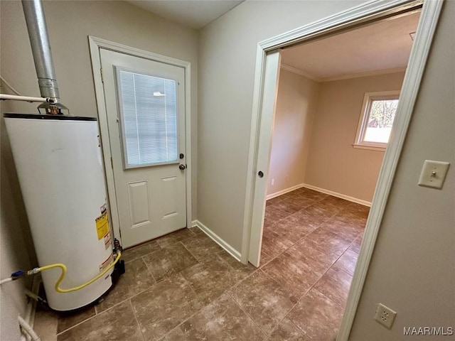 doorway featuring gas water heater and crown molding