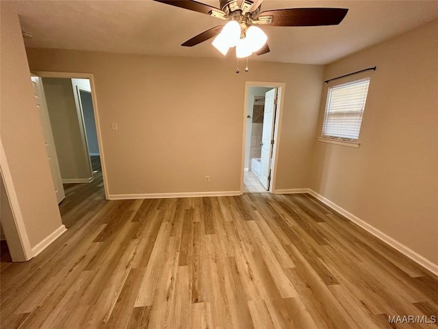 unfurnished room featuring light wood-type flooring and ceiling fan