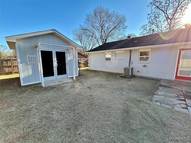 back of property featuring an outdoor structure and central air condition unit