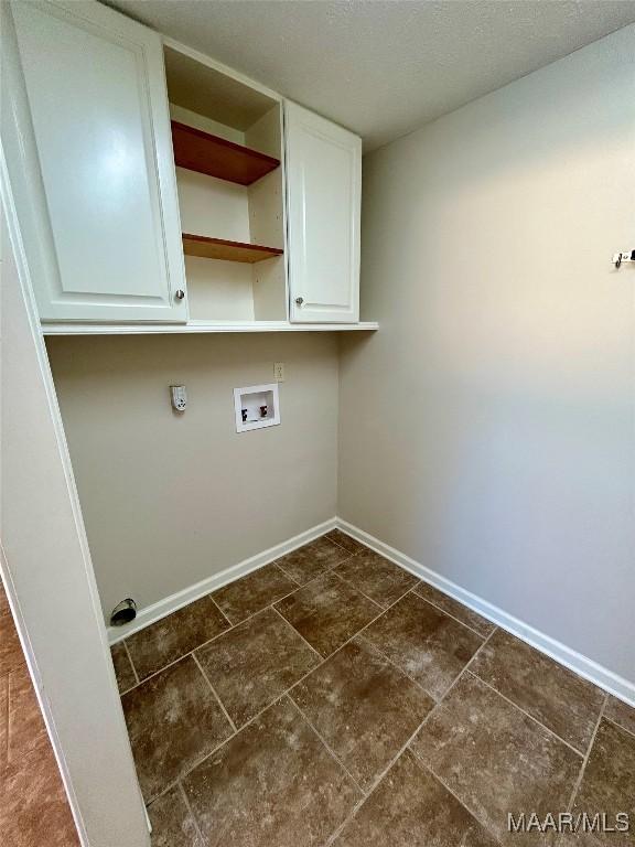 laundry area featuring cabinets and washer hookup