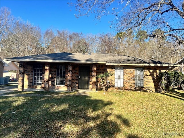 ranch-style home with a front lawn