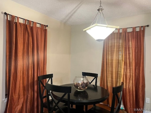 dining area with a textured ceiling