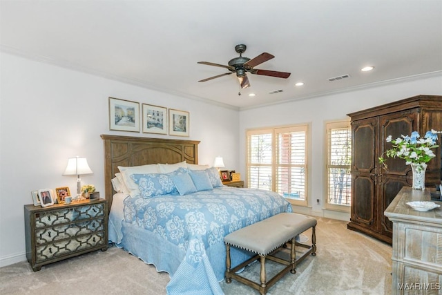 carpeted bedroom featuring ceiling fan and ornamental molding