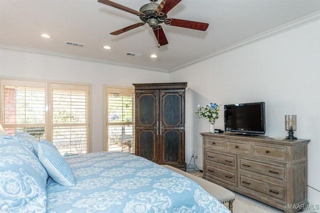 bedroom with ceiling fan and crown molding