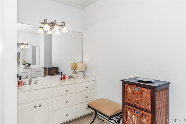 bathroom with ornamental molding, tile patterned flooring, and vanity