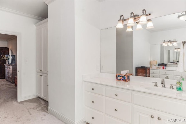 bathroom with crown molding and vanity