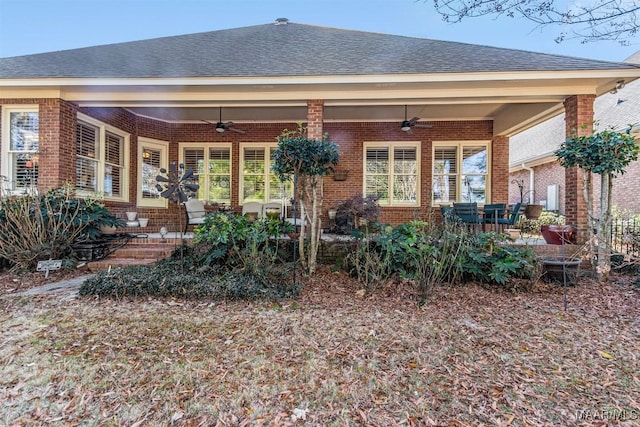 back of property featuring ceiling fan