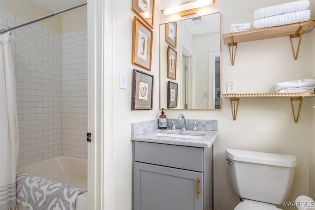 bathroom featuring toilet, shower / bath combo, vanity, and visible vents