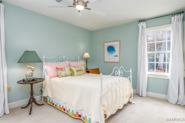 bedroom with baseboards, a ceiling fan, and carpet floors