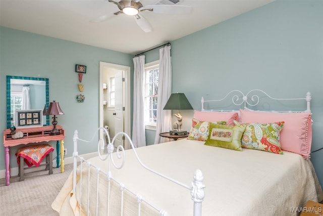bedroom featuring ceiling fan, baseboards, and carpet
