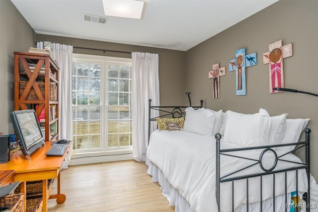 bedroom with light wood-type flooring