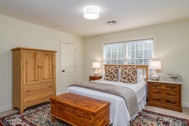 bedroom with visible vents and baseboards