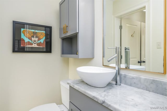 bathroom with toilet and vanity