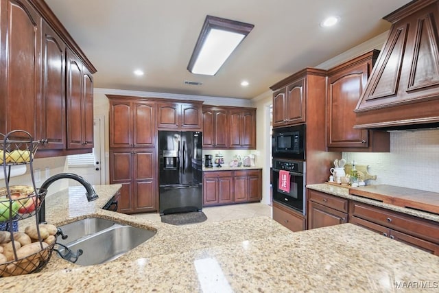 kitchen featuring premium range hood, black appliances, tasteful backsplash, crown molding, and sink