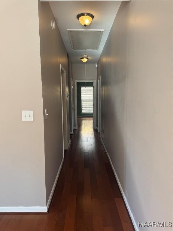 corridor with dark hardwood / wood-style floors