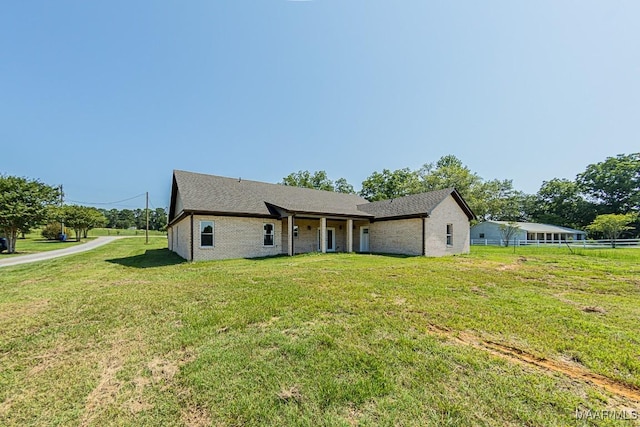 ranch-style house with a front lawn