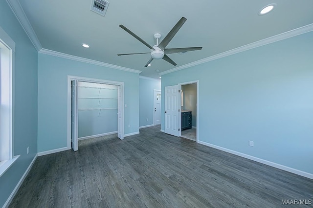 unfurnished bedroom with ceiling fan, dark wood-type flooring, ornamental molding, and a closet