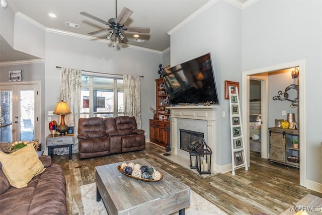 living room with french doors, ceiling fan, hardwood / wood-style flooring, and ornamental molding