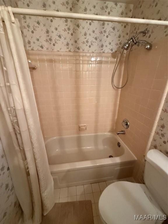 bathroom with tile patterned flooring, toilet, and shower / bath combo