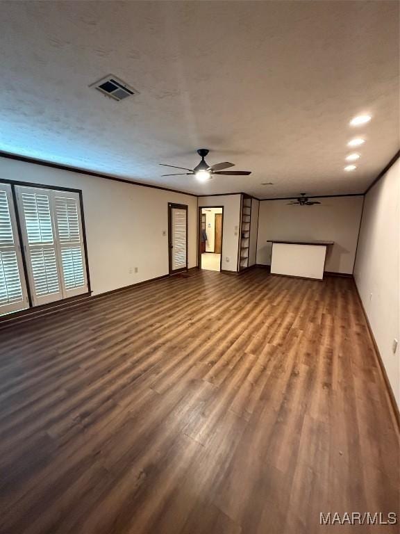 unfurnished living room with wood-type flooring and ceiling fan