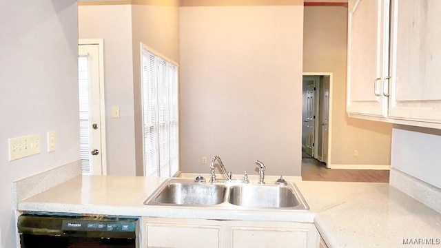 kitchen with black dishwasher and sink