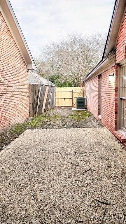 view of yard with cooling unit and a patio area