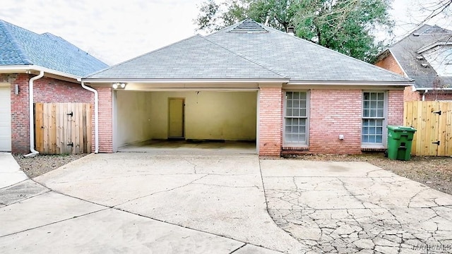 back of house featuring a garage