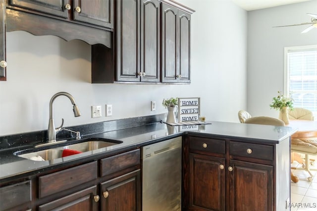 kitchen with sink, dark brown cabinets, light tile patterned floors, stainless steel dishwasher, and kitchen peninsula