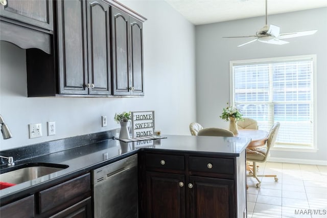 kitchen with dishwasher, sink, light tile patterned floors, ceiling fan, and dark brown cabinetry