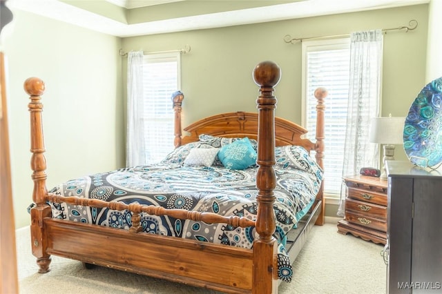 carpeted bedroom with ornamental molding