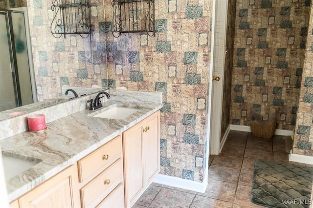 bathroom featuring vanity and a shower with door