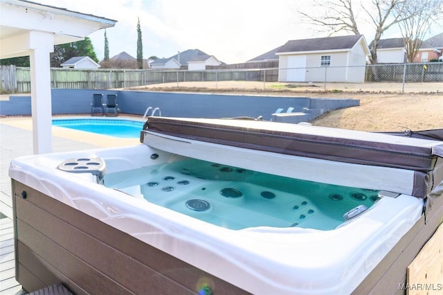 view of pool featuring a hot tub