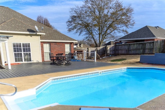 view of pool with a wooden deck