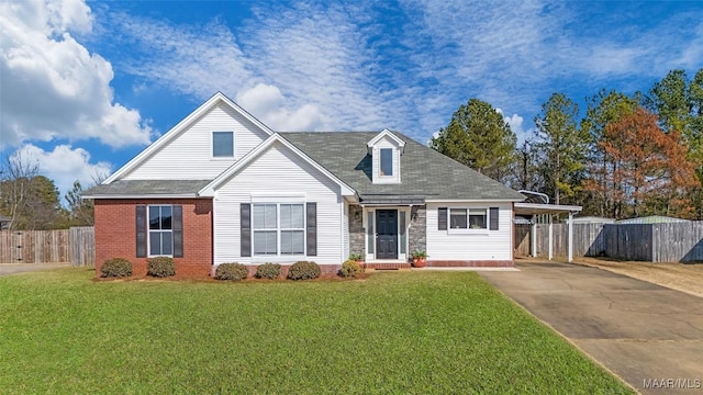 view of front of house featuring a front yard and a carport