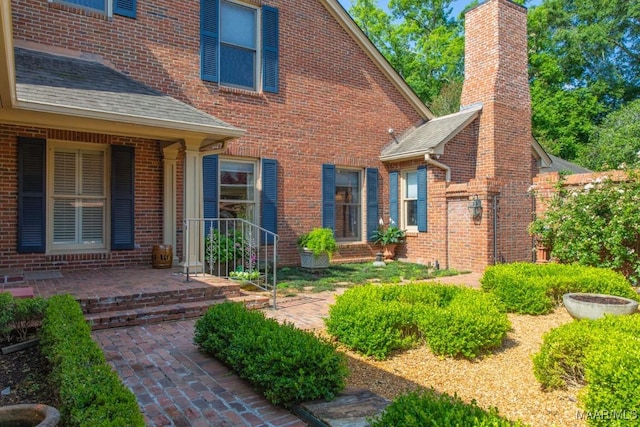 entrance to property with a patio