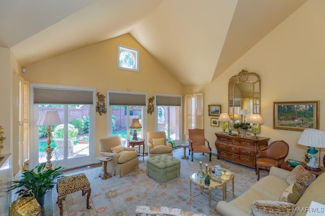 living room featuring lofted ceiling and a healthy amount of sunlight