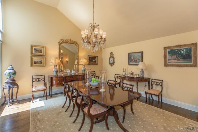 dining space featuring lofted ceiling, dark hardwood / wood-style flooring, and a notable chandelier