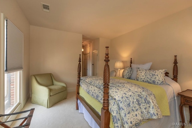 bedroom featuring light carpet