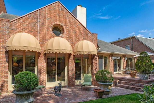 back of house featuring a patio area