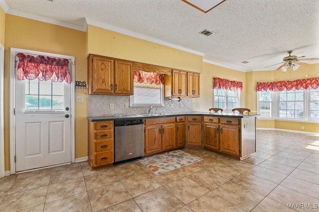 kitchen with a textured ceiling, ceiling fan, light tile patterned floors, stainless steel dishwasher, and decorative backsplash