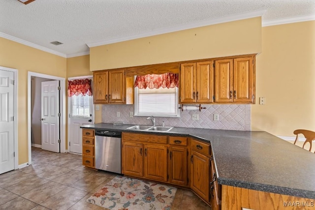 kitchen featuring sink, light tile patterned floors, a textured ceiling, and dishwasher