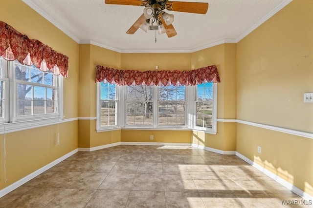 tiled spare room with a textured ceiling, ornamental molding, and ceiling fan