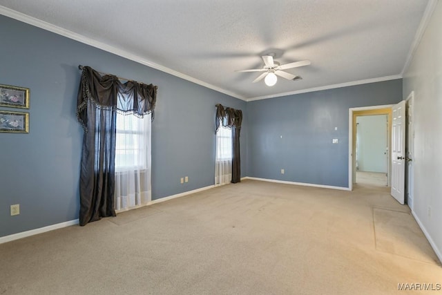 unfurnished room with a textured ceiling, ceiling fan, ornamental molding, and light colored carpet