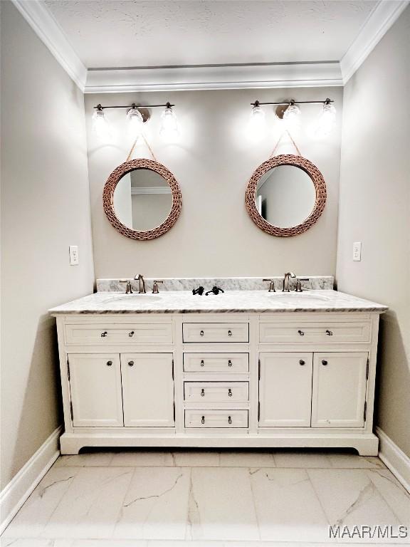 bathroom with ornamental molding and vanity